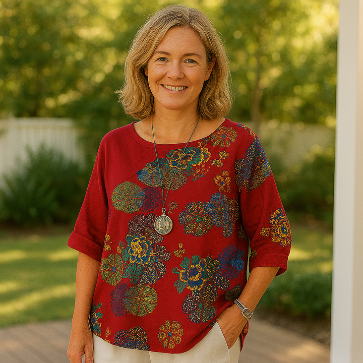 Loose-fitting blouse with floral sleeve